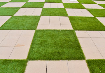Pavers / Artificial Turf Pavers with artificial turf in a checkerboard pattern