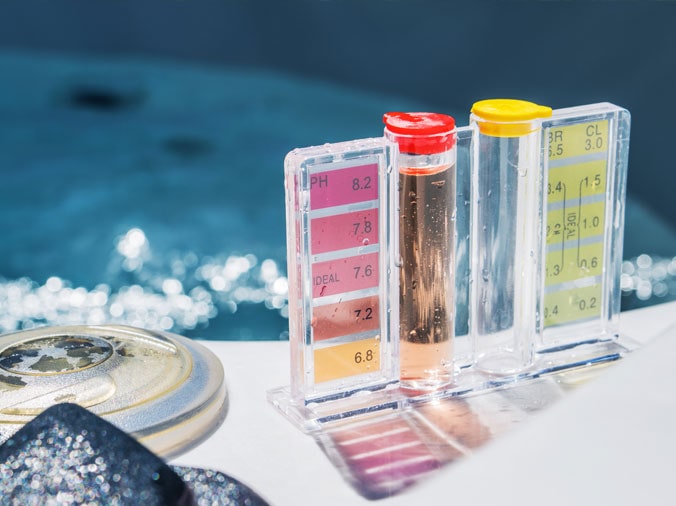 Pool testing kit on the side of a private swimming pool